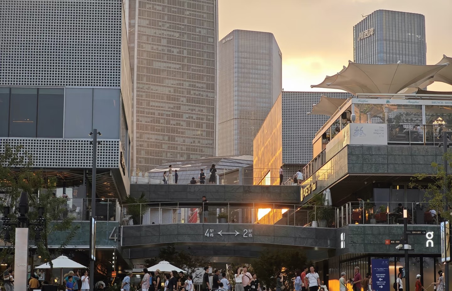 Sunset over the plaza and industrial buildings at Gate M West Bund Dream Center in Shanghai
